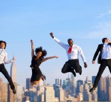 Happy Successful Business People Celebrating and Jumping in New York City
