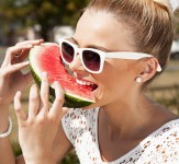 Woman takes watermelon. Concept of healthy and dieting food